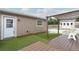 Backyard featuring pergola, seating, artificial turf and shed at 1078 Aaron Dr, Deltona, FL 32725