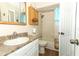 Bathroom vanity, sink, toilet, tub and blue shower curtain at 1078 Aaron Dr, Deltona, FL 32725