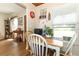 Bright dining area features a table set for four with a view of the neighborhood at 1078 Aaron Dr, Deltona, FL 32725