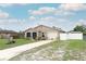 Attractive single-story home with a well-kept lawn, driveway, and charming curb appeal at 1078 Aaron Dr, Deltona, FL 32725