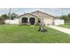 Charming home with well-manicured lawn, stone accents, and an attached one-car garage at 1078 Aaron Dr, Deltona, FL 32725