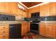 Updated kitchen featuring stainless steel appliances, granite counters, and wood cabinets at 1078 Aaron Dr, Deltona, FL 32725