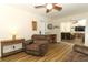 Comfortable living room with mirrored wall reflects the spacious living area at 1078 Aaron Dr, Deltona, FL 32725