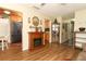 Open living area with wood-look floors that connect the living room to kitchen at 1078 Aaron Dr, Deltona, FL 32725