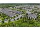 Scenic aerial view of a residential community with lush greenery, well-maintained homes, and tree-lined streets at 11054 Hanlon Terrace Aly, Winter Garden, FL 34787