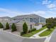 Well-maintained townhomes with solar panels, garages, and neatly manicured landscaping at 11054 Hanlon Terrace Aly, Winter Garden, FL 34787