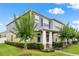 Beautiful exterior of a two-story home with a well-manicured lawn, landscaped yard, and covered front porch at 11054 Hanlon Terrace Aly, Winter Garden, FL 34787