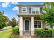 Charming two-story home with well-maintained landscaping, covered porch, and neutral color palette at 11054 Hanlon Terrace Aly, Winter Garden, FL 34787