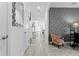 Bright hallway with tile flooring, decorative wallpaper, and natural light streaming through the open-concept layout at 11054 Hanlon Terrace Aly, Winter Garden, FL 34787