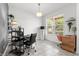 Bright office with large windows, neutral walls, and stylish decor perfect for productivity at 11054 Hanlon Terrace Aly, Winter Garden, FL 34787