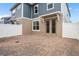 Private patio with brick pavers and white fence, perfect for outdoor relaxation and entertaining at 11054 Hanlon Terrace Aly, Winter Garden, FL 34787
