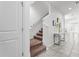 Bright staircase with neutral carpet and white trim, leading to the upper level of the home at 11054 Hanlon Terrace Aly, Winter Garden, FL 34787