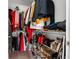 Well-organized walk-in closet with shelves and rods for ample storage of clothes, bags, and shoes at 11054 Hanlon Terrace Aly, Winter Garden, FL 34787