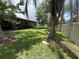 View of the backyard with a trampoline and a screened-in patio, ideal for entertaining and relaxing at 12679 Calderdale Ave, Windermere, FL 34786