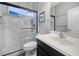 Modern bathroom with a glass-enclosed shower featuring marble-like tile and sleek fixtures at 12679 Calderdale Ave, Windermere, FL 34786
