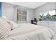 Bright bedroom with carpet floors and view of home entertainment system on wall at 12679 Calderdale Ave, Windermere, FL 34786