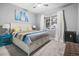 Inviting bedroom with carpet flooring, large window, and a comfortable bed setting at 12679 Calderdale Ave, Windermere, FL 34786