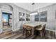 Charming dining room with modern chandelier, elegant artwork, and sleek gray walls at 12679 Calderdale Ave, Windermere, FL 34786