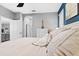 Bright main bedroom shows view to bathroom, gray walls, and carpet floors at 12679 Calderdale Ave, Windermere, FL 34786