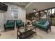 Inviting screened patio with wicker furniture, stylish cushions, and a glass-top coffee table at 12679 Calderdale Ave, Windermere, FL 34786