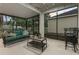 Relaxing screened patio with outdoor seating, a coffee table, and a view of the backyard at 12679 Calderdale Ave, Windermere, FL 34786