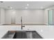 Modern kitchen featuring a stainless steel sink, and stone countertops at 136 N James Pl, Groveland, FL 34736