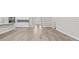 Open concept living space showcasing wood-look flooring and neutral paint at 136 N James Pl, Groveland, FL 34736
