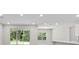 Bright living space with sliding glass doors to the yard and large windows at 136 N James Pl, Groveland, FL 34736