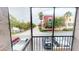 Screened balcony view overlooking the street and shops at 145 Oyster Bay Cir # 200, Altamonte Springs, FL 32701