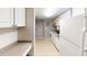 Functional kitchen featuring white appliances and tile flooring at 145 Oyster Bay Cir # 200, Altamonte Springs, FL 32701