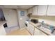 Efficient kitchen with white appliances, gas range, and granite-look countertops at 145 Oyster Bay Cir # 200, Altamonte Springs, FL 32701