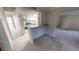 Open kitchen features a breakfast bar, neutral countertops, and modern appliances at 145 Oyster Bay Cir # 200, Altamonte Springs, FL 32701
