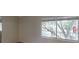 Bright living room with a window looking onto a tree-lined balcony at 145 Oyster Bay Cir # 200, Altamonte Springs, FL 32701