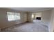 Bright living room with large window and neutral carpeting at 145 Oyster Bay Cir # 200, Altamonte Springs, FL 32701