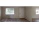 Bright living room featuring carpeted floors and natural light through the windows at 145 Oyster Bay Cir # 200, Altamonte Springs, FL 32701