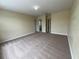 Generous carpeted bedroom with multiple entrances and neutral paint at 14508 Cedar Branch Way, Orlando, FL 32824