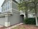 Home with attached garage, shrubbery, and mature tree at 14508 Cedar Branch Way, Orlando, FL 32824