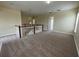 Spacious loft area with carpet flooring and plenty of natural light at 14508 Cedar Branch Way, Orlando, FL 32824