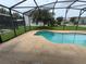 Sparkling pool in a screened enclosure offers a refreshing escape and outdoor enjoyment at 14508 Cedar Branch Way, Orlando, FL 32824