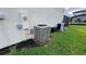 View of the side of the home with two AC units outside at 16631 Lazy Breeze Loop, Clermont, FL 34714