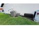 View of the side of the home with two AC units outside at 16631 Lazy Breeze Loop, Clermont, FL 34714