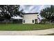 View of the back exterior of the home at 16631 Lazy Breeze Loop, Clermont, FL 34714