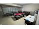 Spacious garage furnished with games: air hockey, pool, and ping pong at 16631 Lazy Breeze Loop, Clermont, FL 34714