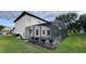 View of the screened-in pool area and backyard at 16631 Lazy Breeze Loop, Clermont, FL 34714