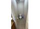 Compact half bathroom featuring a toilet and tile flooring at 16631 Lazy Breeze Loop, Clermont, FL 34714