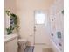 Well-lit bathroom with tub, shower, toilet, vanity, and decor at 1672 Canoe Creek Rd, Oviedo, FL 32766