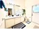 Bright bathroom featuring a double vanity sinks, walk-in shower, and an outdoor entrance at 1672 Canoe Creek Rd, Oviedo, FL 32766