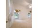 Bright, spacious bedroom featuring carpet, fan, and plenty of natural light at 1672 Canoe Creek Rd, Oviedo, FL 32766