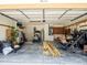 Spacious garage with ample storage space, shelving, and overhead lighting, ready for customization at 1672 Canoe Creek Rd, Oviedo, FL 32766