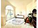 Cozy living area with a large window, stylish furniture, and a decorative rug, offering a comfortable space at 1672 Canoe Creek Rd, Oviedo, FL 32766